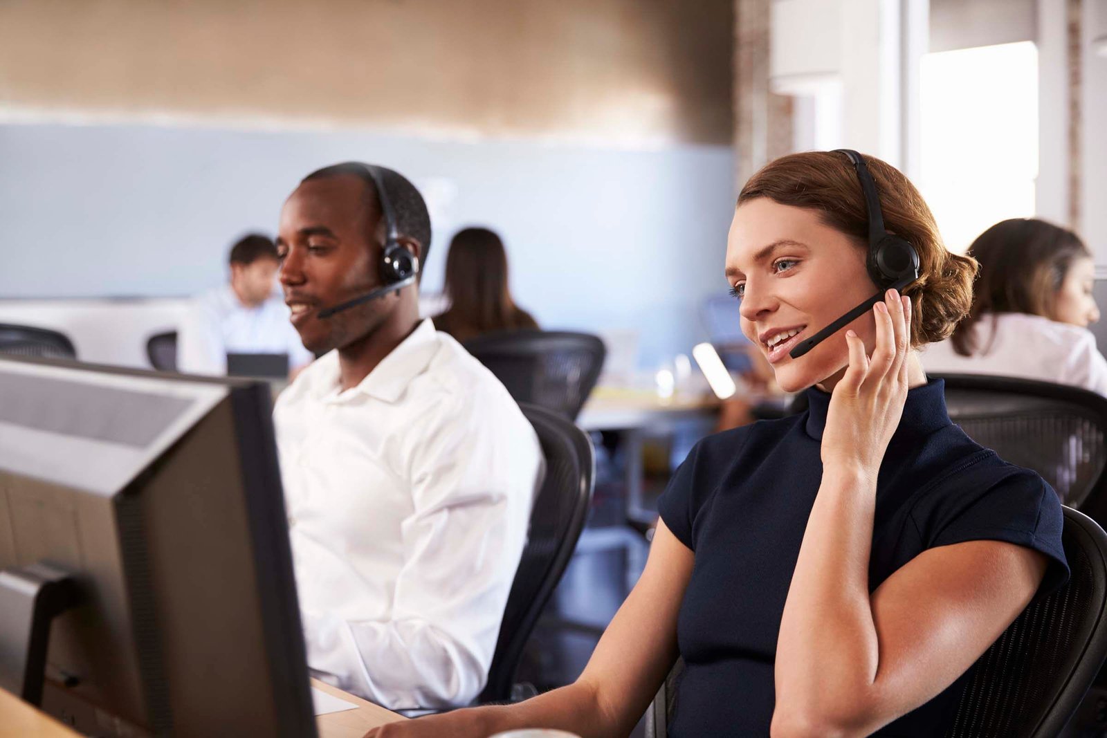 Customer support specialists working together
